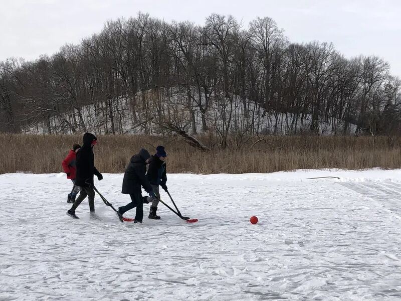 Kids playing together outside in the snow